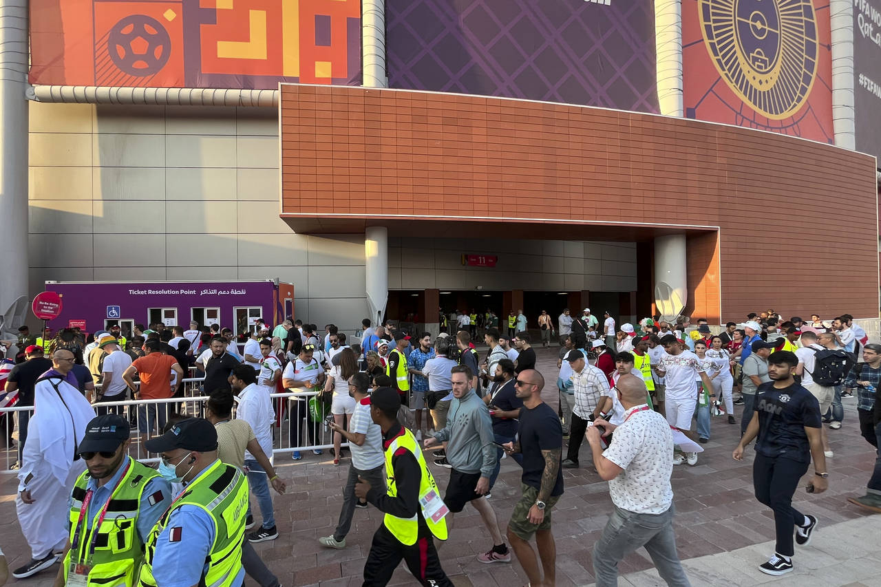 Fans arrive for the World Cup group B soccer match between England and Iran at the Khalifa Internat...