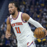 
              New York Knicks guard Jalen Brunson (11) drives to the basket against the Golden State Warriors during the first half of an NBA basketball game in San Francisco, Friday, Nov. 18, 2022. (AP Photo/Jeff Chiu)
            