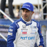 
              FILE - Tony Kanaan is shown before the start an IndyCar auto race at World Wide Technology Raceway on Saturday, Aug. 21, 2021, in Madison, Ill. The tit-for-tat war between Zak Brown and Chip Ganassi took another turn Tuesday, Nov. 1, 2022, when Arrow McLaren SP announced it had signed both a Ganassi sponsor and Tony Kanaan to drive the Indianapolis 500. (AP Photo/Jeff Roberson, File)
            
