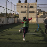 
              Palestinian girls practice during a soccer training session at the Beit Hanoun Al-Ahli Youth Club's ground in the northern Gaza strip, Tuesday, Oct. 29, 2022. Women's soccer has been long been neglected in the Middle East, a region that is mad for the men's game and hosts the World Cup for the first time this month in Qatar. (AP Photo/Fatima Shbair)
            
