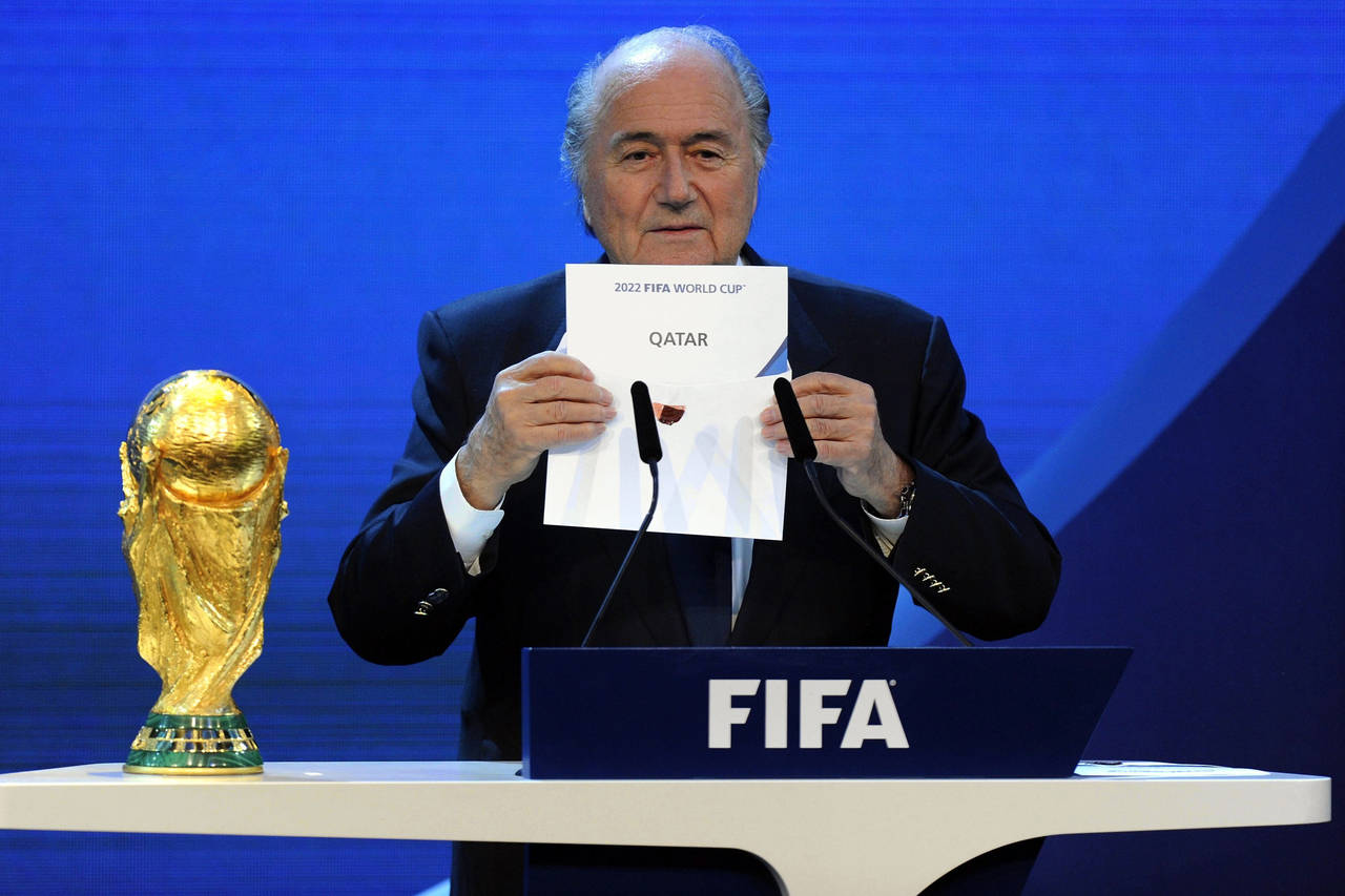 FILE - FIFA President Joseph S. Blatter announces that Qatar will be hosting the 2022 Soccer World ...