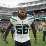 
              New York Jets linebacker Quincy Williams (56) celebrates after an NFL football game against the Buffalo Bills, Sunday, Nov. 6, 2022, in East Rutherford, N.J. (AP Photo/John Minchillo)
            