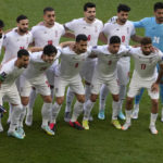 
              Iran players pose ahead of the World Cup group B soccer match between Wales and Iran, at the Ahmad Bin Ali Stadium in Al Rayyan , Qatar, Friday, Nov. 25, 2022. (AP Photo/Manu Fernandez)
            