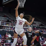 
              Stanford guard Haley Jones (30) scores on a layup next to Cal State Northridge forward Tess Amundsen (15) and guard Jordyn Jackson during the first half of an NCAA college basketball game in Stanford, Calif., Wednesday, Nov. 9, 2022. (AP Photo/Godofredo A. Vásquez)
            