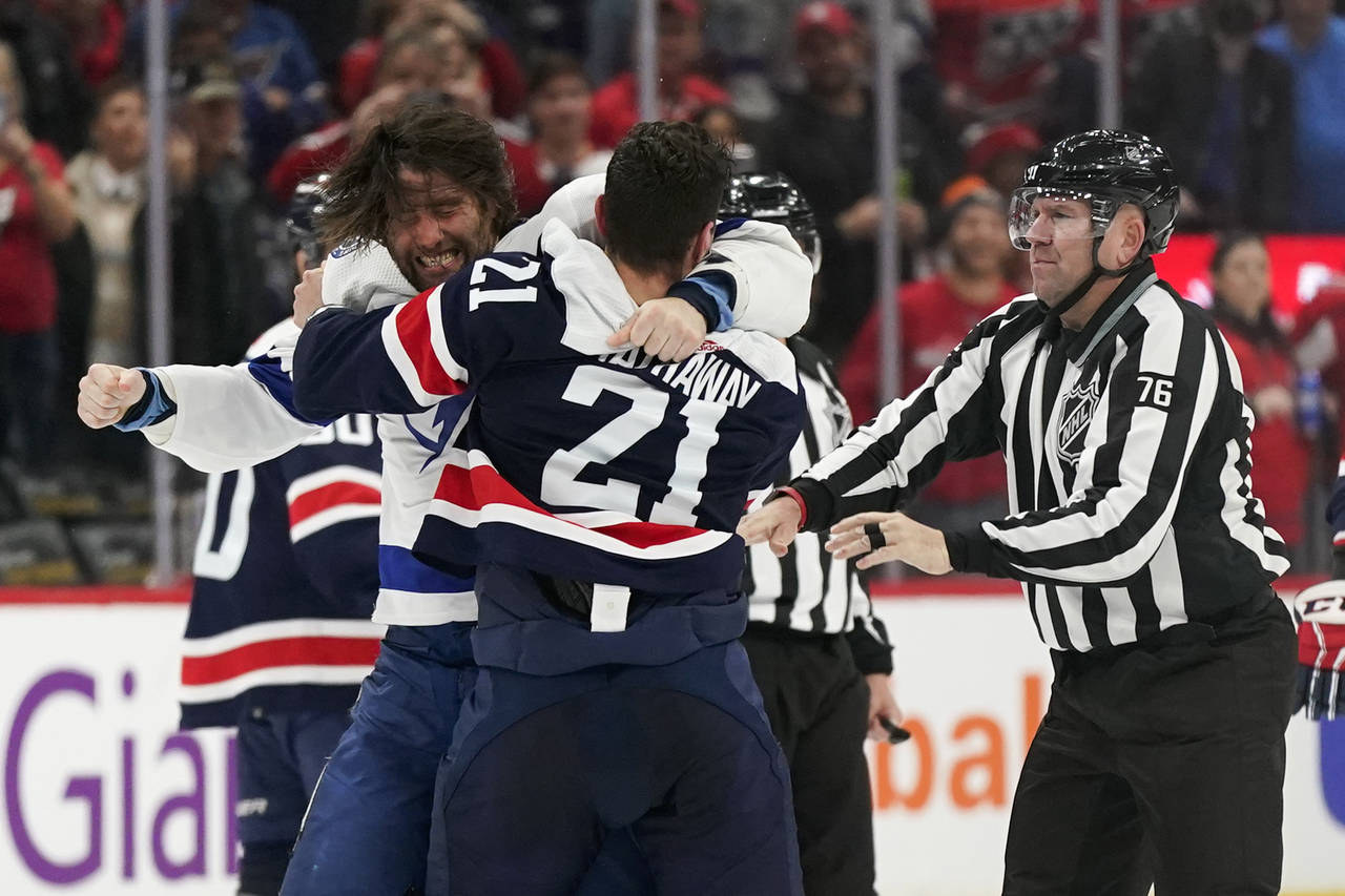 Tampa Bay Lightning left wing Pat Maroon, left, fights with Washington Capitals right wing Garnet H...