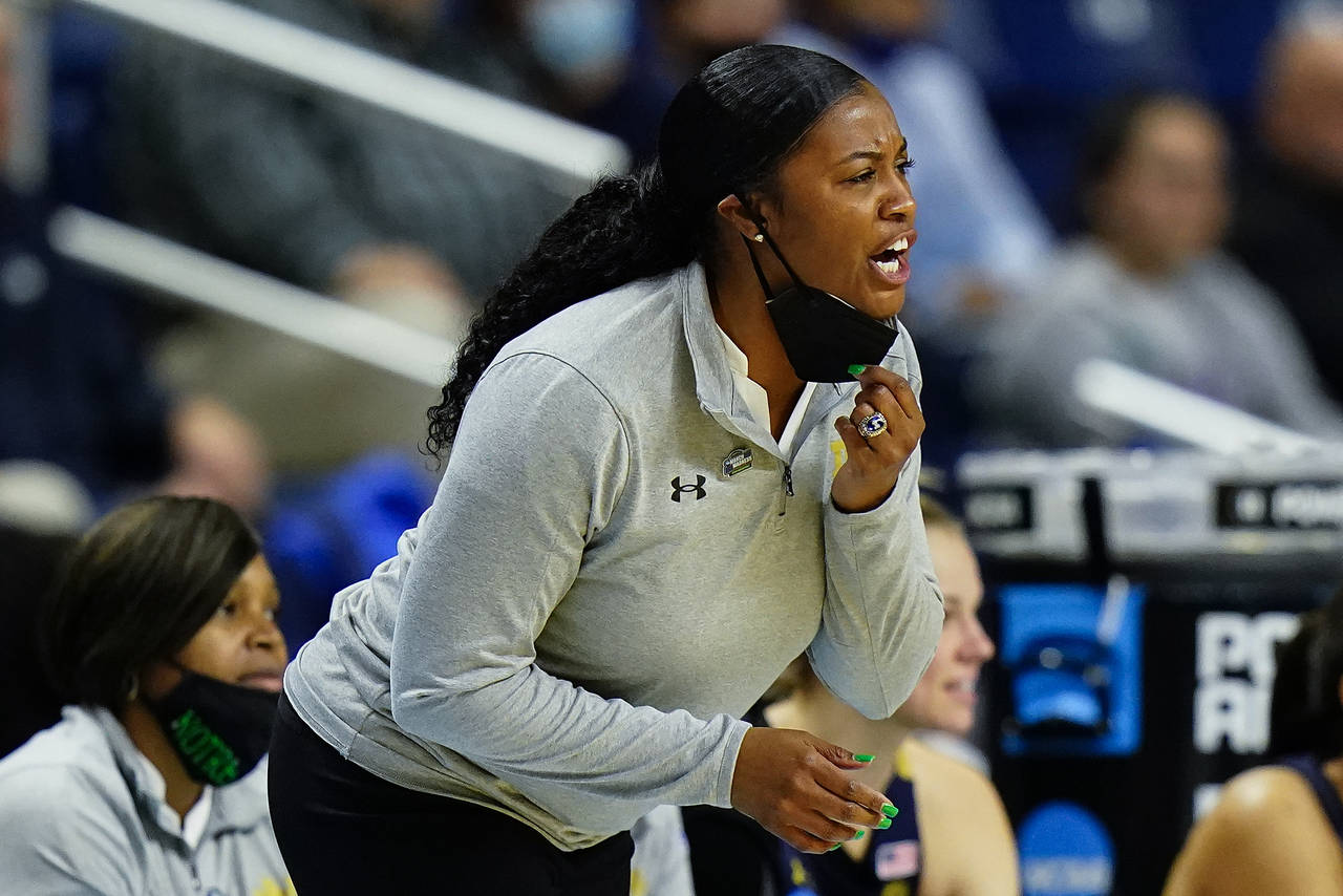 FILE - Notre Dame head coach Niele Ivey shouts to players during the first half of a college basket...