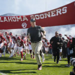 
              Oklahoma coach Brent Venables runs on the field with his players before an NCAA college football game against Baylor, Saturday, Nov. 5, 2022 in Norman, Okla. (AP Photo/Nate Billings)
            