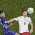 
              Argentina's Cristian Romero, left, challenges for the ball with Poland's Robert Lewandowski during the World Cup group C soccer match between Poland and Argentina at the Stadium 974 in Doha, Qatar, Wednesday, Nov. 30, 2022. (AP Photo/Pavel Golovkin)
            