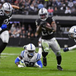 
              Las Vegas Raiders running back Josh Jacobs (28) runs against the Indianapolis Colts in the first half of an NFL football game in Las Vegas, Sunday, Nov. 13, 2022. (AP Photo/David Becker)
            
