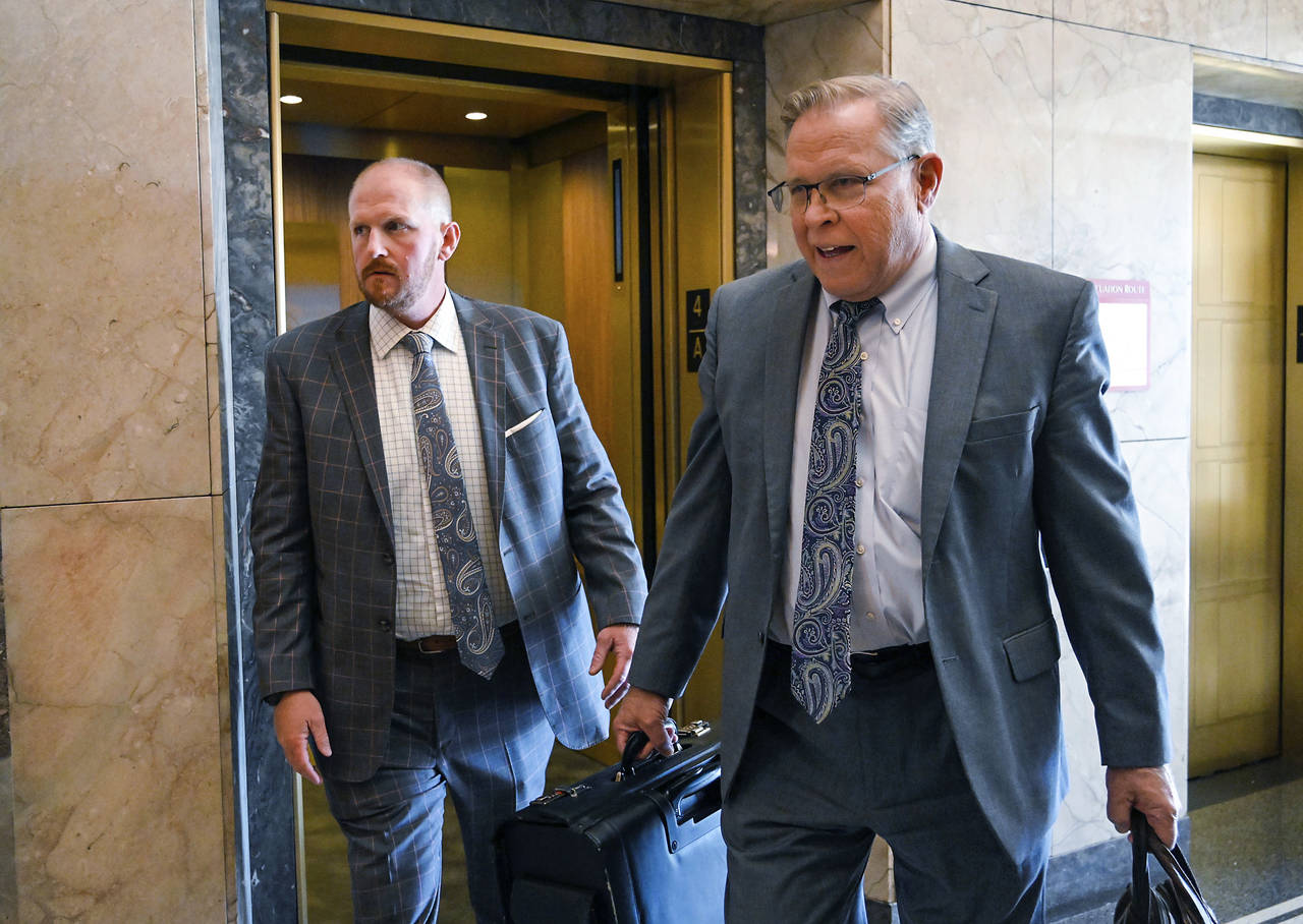Britt Reid, left, walks to a courtroom with his attorney J.R. Hobbs, right, Tuesday, Nov. 1, 2022, ...