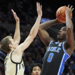 
              Duke forward Dariq Whitehead, right, shoots over Purdue forward Brian Waddell during the first half of an NCAA college basketball game in the Phil Knight Legacy Championship in Portland, Ore., Sunday, Nov. 27, 2022. (AP Photo/Craig Mitchelldyer)
            