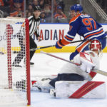 
              Florida Panthers goalie Spencer Knight, foreground, is scored against by Edmonton Oilers' Connor McDavid (97) during second-period NHL hockey game action in Edmonton, Alberta, Monday, Nov. 28, 2022. (Jason Franson/The Canadian Press via AP)
            