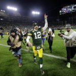 
              ]Green Bay Packers quarterback Aaron Rodgers (12) celebrates as he walks off the field following the team's 31-28 overtime win in an NFL football game against the Dallas Cowboys Sunday, Nov. 13, 2022, in Green Bay, Wis. (AP Photo/Matt Ludtke)
            