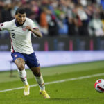 
              FILE - United States' DeAndre Yedlin chases the ball during the first half of a FIFA World Cup qualifying soccer match between Mexico and the United States, Friday, Nov. 12, 2021, in Cincinnati. On what figures to be the youngest of the 32 teams by average age, 29-year-old right back DeAndre Yedlin is the only holdover from the 2014 World Cup.  (AP Photo/Julio Cortez, File)
            