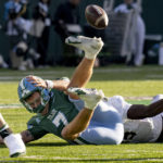 
              Tulane quarterback Michael Pratt fumbles after getting tackled by UCF linebacker Jason Johnson during an NCAA college football game in New Orleans, Saturday, Nov. 12, 2022. (AP Photo/Matthew Hinton)
            