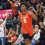 
              Illinois guard Terrence Shannon Jr. celebrates a 3-point basket against UCLA during the second half of an NCAA college basketball game Friday, Nov. 18, 2022, in Las Vegas. (AP Photo/Chase Stevens)
            