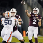 
              Mississippi State quarterback Will Rogers (2) throws a pass as Auburn defensive lineman Marcus Harris (50) is blocked during the second half of an NCAA college football game in Starkville, Miss., Saturday, Nov. 5, 2022. Mississippi State won 39-33. (AP Photo/Rogelio V. Solis)
            