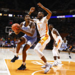 
              McNeese State forward Malachi Rhodes (23) works for a shot against Tennessee forward Jonas Aidoo (0) during the first half of an NCAA college basketball game Wednesday, Nov. 30, 2022, in Knoxville, Tenn. (AP Photo/Wade Payne)
            