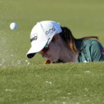 
              Leona Maguire, of Ireland, hits from a bunker onto the 17th green during the third round of the LPGA CME Group Tour Championship golf tournament, Saturday, Nov. 19, 2022, at the Tiburón Golf Club in Naples, Fla. (AP Photo/Lynne Sladky)
            