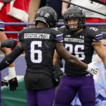 
              Northwestern running back Evan Hull, right, celebrates with wide receiver Malik Washington after scoring a his touchdown during the first half of an NCAA college football game against Ohio State, Saturday, Nov. 5, 2022, in Evanston, Ill. (AP Photo/Nam Y. Huh)
            