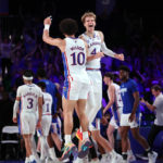 
              In a photo provided by Bahamas Visual Services, Kansas' Jalen Wilson (10) and Gradey Dick (4) celebrate during an NCAA college basketball game against Wisonsin in the Battle 4 Atlantis at Paradise Island, Bahamas, Thursday, Nov. 24, 2022. (Tim Aylen/Bahamas Visual Services via AP)
            