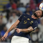 
              France's Olivier Giroud heads the ball during the World Cup group D soccer match between France and Denmark, at the Stadium 974 in Doha, Qatar, Saturday, Nov. 26, 2022. (AP Photo/Martin Meisner)
            