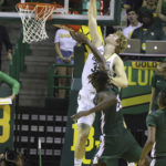 
              Baylor forward Caleb Lohner (33) is fouled while attempting to score over Mississippi Valley State center Daniel Umoh (35) in the first half of an NCAA college basketball game, Monday, Nov. 7, 2022, in Waco, Texas. (AP Photo/Rod Aydelotte)
            