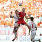 
              Iran's Morteza Pouraliganji, left, and Wales' Gareth Bale go for a header during the World Cup group B soccer match between Wales and Iran, at the Ahmad Bin Ali Stadium in Al Rayyan , Qatar, Friday, Nov. 25, 2022. (AP Photo/Francisco Seco)
            
