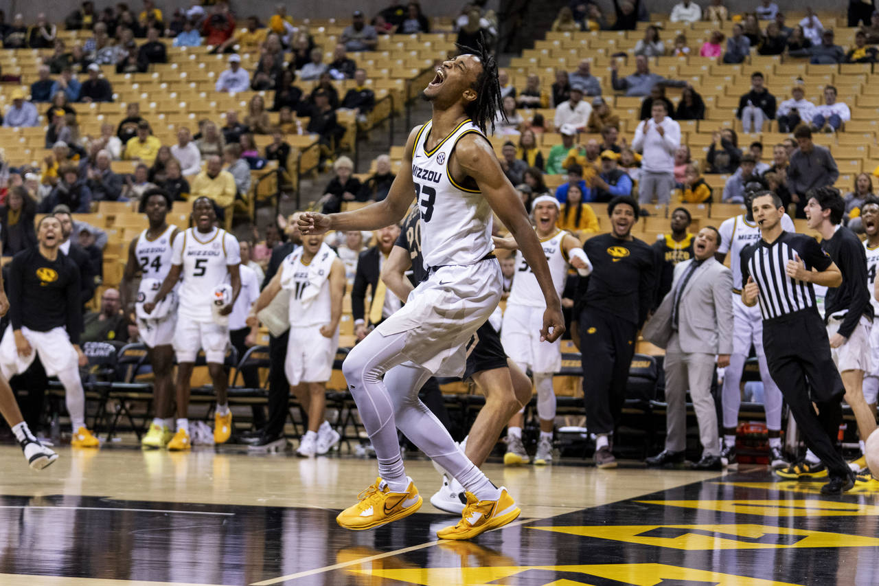Missouri's Aidan Shaw screams after a dunk during the second half of an NCAA college basketball gam...