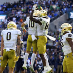 
              Notre Dame wide receiver Jayden Thomas, right, celebrates his first half touchdown with quarterback Drew Pyne (10) during an NCAA college football game, Saturday, Nov. 12, 2022, in Baltimore. (AP Photo/Terrance Williams)
            
