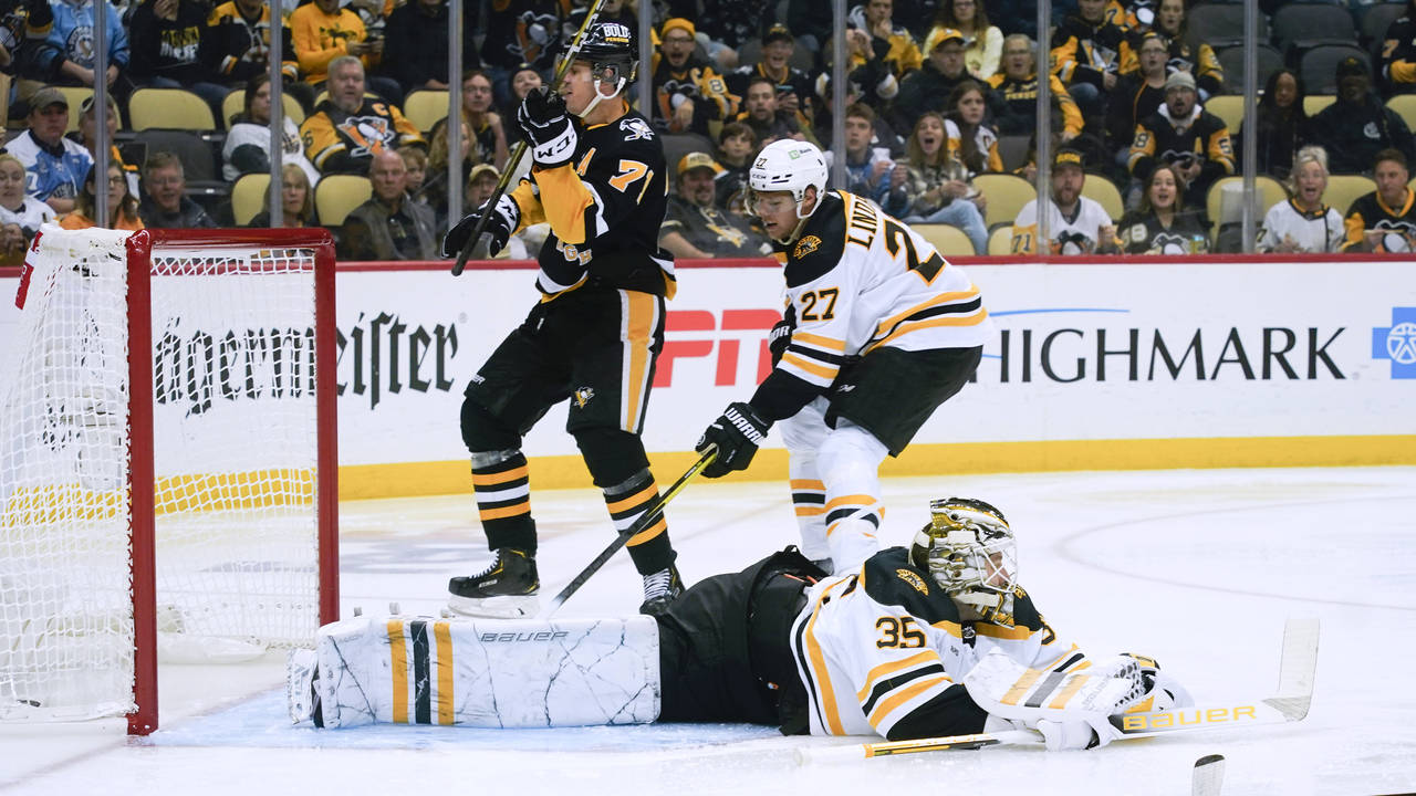 Pittsburgh Penguins' Evgeni Malkin (71) celebrates after scoring on Boston Bruins goaltender Linus ...
