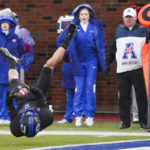 
              SMU wide receiver Jordan Kerley flips toward the end zone after being knocked off his feet by the Memphis defense after a catch during the first half of an NCAA college football game at Ford Stadium on Saturday, Nov. 26, 2022, in Dallas. (Smiley N. Pool/The Dallas Morning News via AP)
            