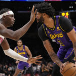 
              Los Angeles Lakers forward Anthony Davis, right tries to get by Detroit Pistons center Jalen Duren during the first half of an NBA basketball game Friday, Nov. 18, 2022, in Los Angeles. (AP Photo/Mark J. Terrill)
            