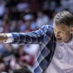 
              Alabama coach Nate Oats signals to players during the first half of an NCAA college basketball game against Longwood, Monday, Nov. 7, 2022, in Tuscaloosa, Ala. (AP Photo/Vasha Hunt)
            