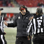 
              Louisville head coach Scott Satterfield, center, argues with officials during the second half of an NCAA college football game against North Carolina State in Louisville, Ky., Saturday, Nov. 19, 2022. (AP Photo/Timothy D. Easley)
            