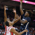 
              Charleston Southern's Taje Kelly, right, shoots over Ohio State's Zed Key during the first half of an NCAA college basketball game Thursday, Nov. 10, 2022, in Columbus, Ohio. (AP Photo/Jay LaPrete)
            