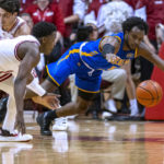 
              Morehead State guard Branden Maughmer, right, and Indiana guard Xavier Johnson dive for the ball during the second half of an NCAA college basketball game Monday, Nov. 7, 2022, in Bloomington, Ind. (AP Photo/Doug McSchooler)
            