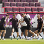 
              Germany's Leon Goretzka, left, and Joshua Kimmich challenge for the ball surrounded by team mates during a training session at the Al-Shamal stadium on the eve of the group E World Cup soccer match between Germany and Japan, in Al-Ruwais, Qatar, Tuesday, Nov. 22, 2022. Germany will play the first match against Japan on Wednesday, Nov. 23. (AP Photo/Matthias Schrader)
            