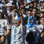 
              Argentina's soccer fans react as they watch their team's match against Mexico at the World Cup, hosted by Qatar, in Buenos Aires, Argentina, Saturday, Nov. 26, 2022. (AP Photo/Gustavo Garello)
            