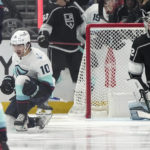 
              Seattle Kraken center Matty Beniers, left, celebrates his goal as Los Angeles Kings goaltender Jonathan Quick sits in goal during the second period of an NHL hockey game Tuesday, Nov. 29, 2022, in Los Angeles. (AP Photo/Mark J. Terrill)
            