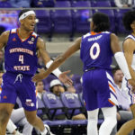 
              Northwestern State guard JaMonta' Black (4) celebrates his score with teammate Demarcus Sharp (0) in front of TCU guard Micah Peavy (0) in the final minutes of the second half of an NCAA college basketball game in Fort Worth, Texas, Monday, Nov. 14, 2022. Northwestern State won 64-63. (AP Photo/LM Otero)
            