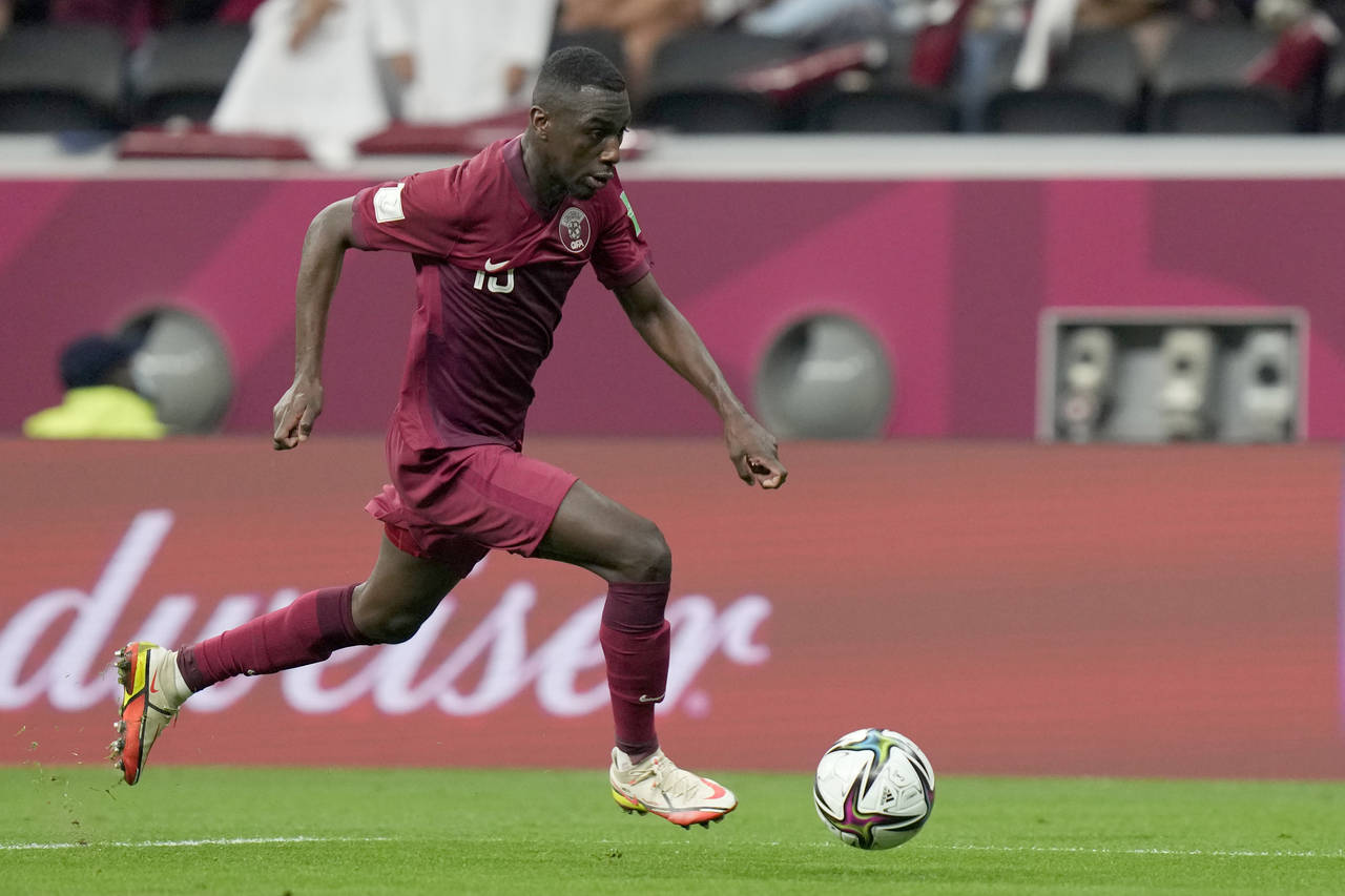 FILE - Qatar's Almoez Ali is in action during the group A Arab Cup soccer match between Qatar and B...