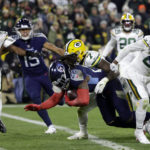 
              Tennessee Titans running back Derrick Henry (22) dives into the end zone to score a touchdown as Green Bay Packers linebacker Quay Walker (7) attempted to make the stop during the first half of an NFL football game Thursday, Nov. 17, 2022, in Green Bay, Wis. (AP Photo/Matt Ludtke)
            