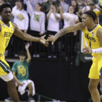 
              Baylor guard Adam Flagler, left, congratulates Baylor guard Keyonte George, right, after he made a three point shot in the second half of an NCAA college basketball game against Norfolk State, Friday, Nov. 11, 2022, in Waco, Texas. (AP Photo/Jerry Larson)
            