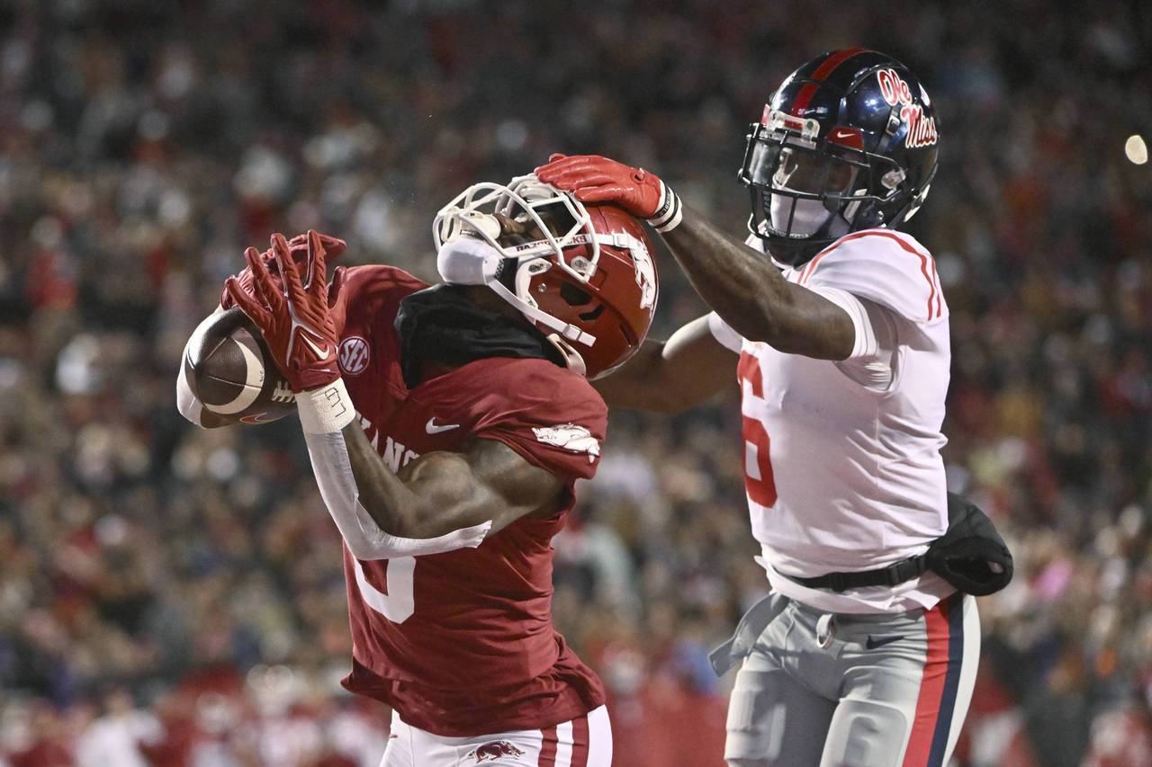 Arkansas wide receiver Matt Landers (3) makes a touchdown catch in front of Mississippi defensive b...