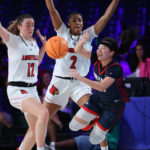 
              In a photo provided by Bahamas Visual Services, Gonzaga guard Kayleigh Truong, right, is defended by Louisville guard Payton Verhulst, left, and forward Nyla Harris during an NCAA college basketball game in the Battle 4 Atlantis at Paradise Island, Bahamas, Saturday, Nov. 19, 2022. (Tim Aylen/Bahamas Visual Services via AP)
            