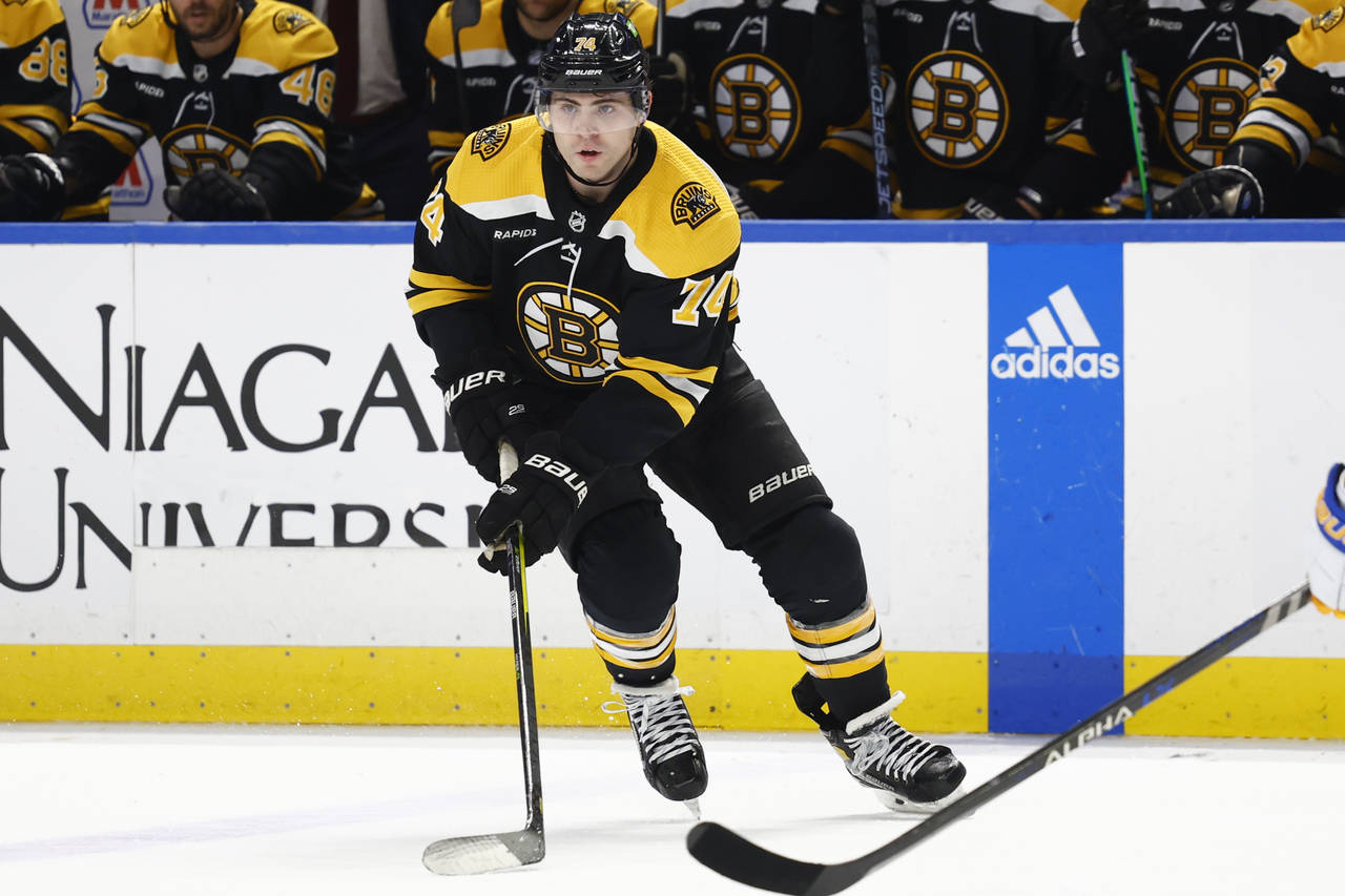Boston Bruins left wing Jake DeBrusk (74) controls the puck past the blue line during the second pe...