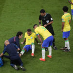 
              Brazil's Neymar, lies on the pitch as he receives first aid during the World Cup group G soccer match between Brazil and Serbia, at the the Lusail Stadium in Lusail, Qatar on Thursday, Nov. 24, 2022. (AP Photo/Darko Vojinovic)
            