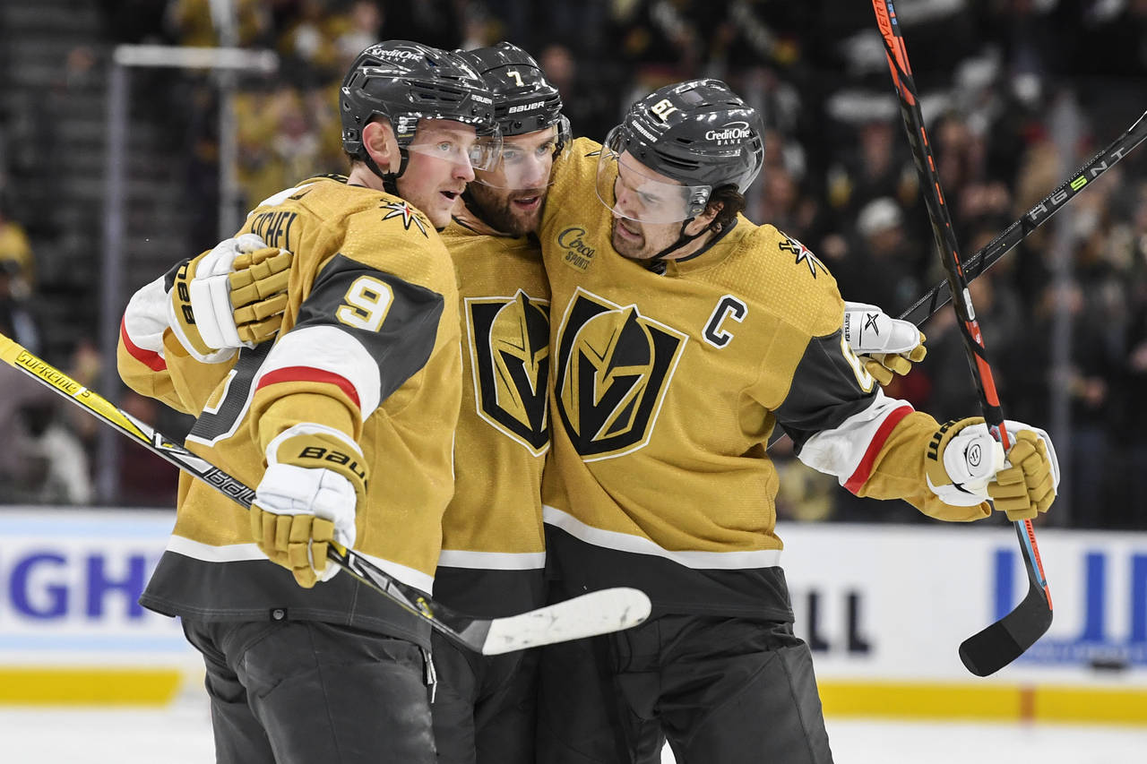 Vegas Golden Knights center Jack Eichel (9) and right wing Mark Stone, right, celebrate defenseman ...