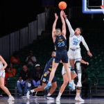 
              In a photo provided by Bahamas Visual Services, Marquette's Jordan King (23) goes up against UCLA's Camryn Brown (35) during the NCAA college basketball championship game in the Battle 4 Atlantis at Paradise Island, Bahamas, Monday, Nov. 21, 2022. (Tim Aylen/Bahamas Visual Services via AP)
            